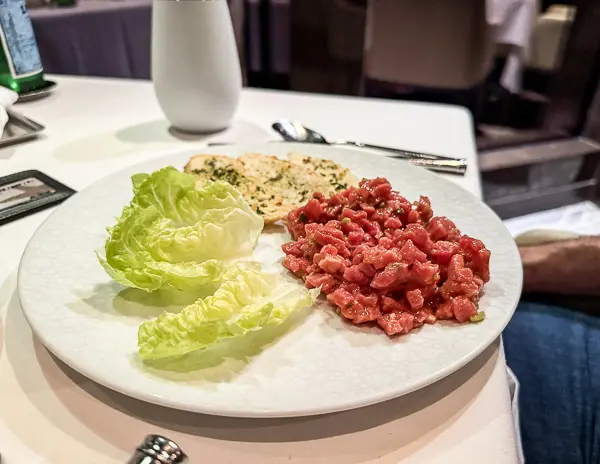 A classic steak tartare paired with lettuce cups and crispy garlic bread at the Haven restaurant.