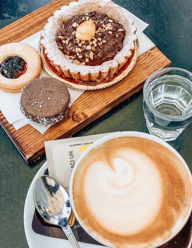 Enjoying sweet treats & cappuccino • A Quick Road Trip to Lucca, Italy >> TastyItinerary.com