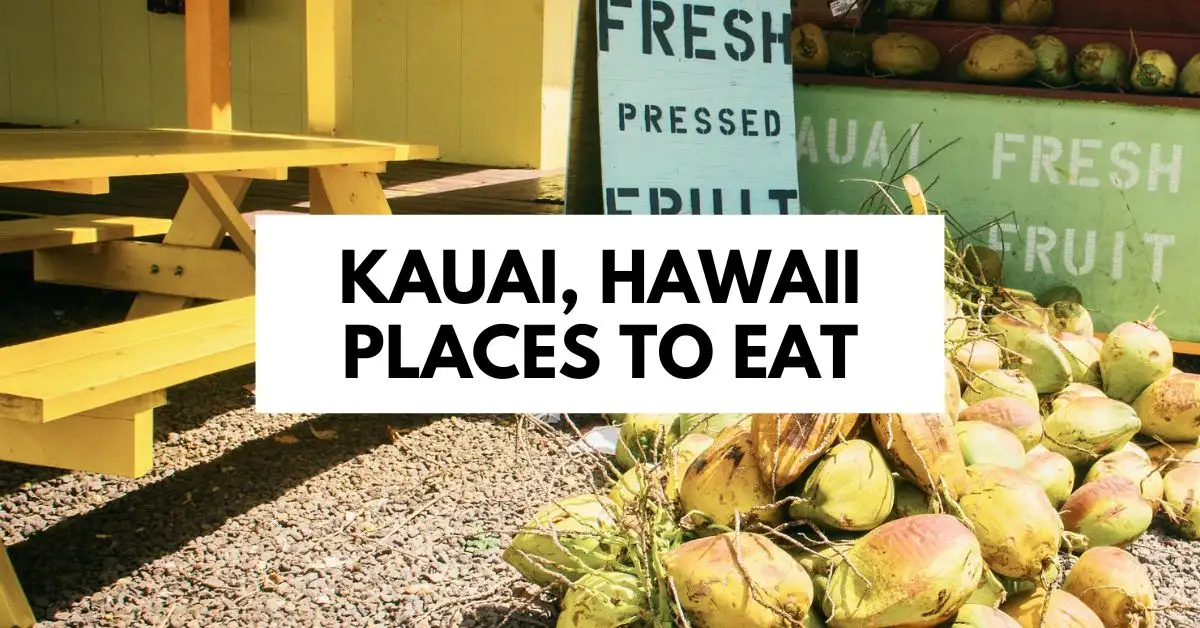 featured blog image: A vibrant scene showing fresh coconuts and a sign for fresh pressed fruit, with text overlay reading "Kauai, Hawaii Places to Eat."