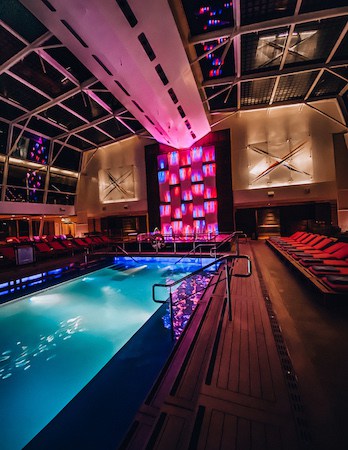 Cruise ship solarium pool lit up at night