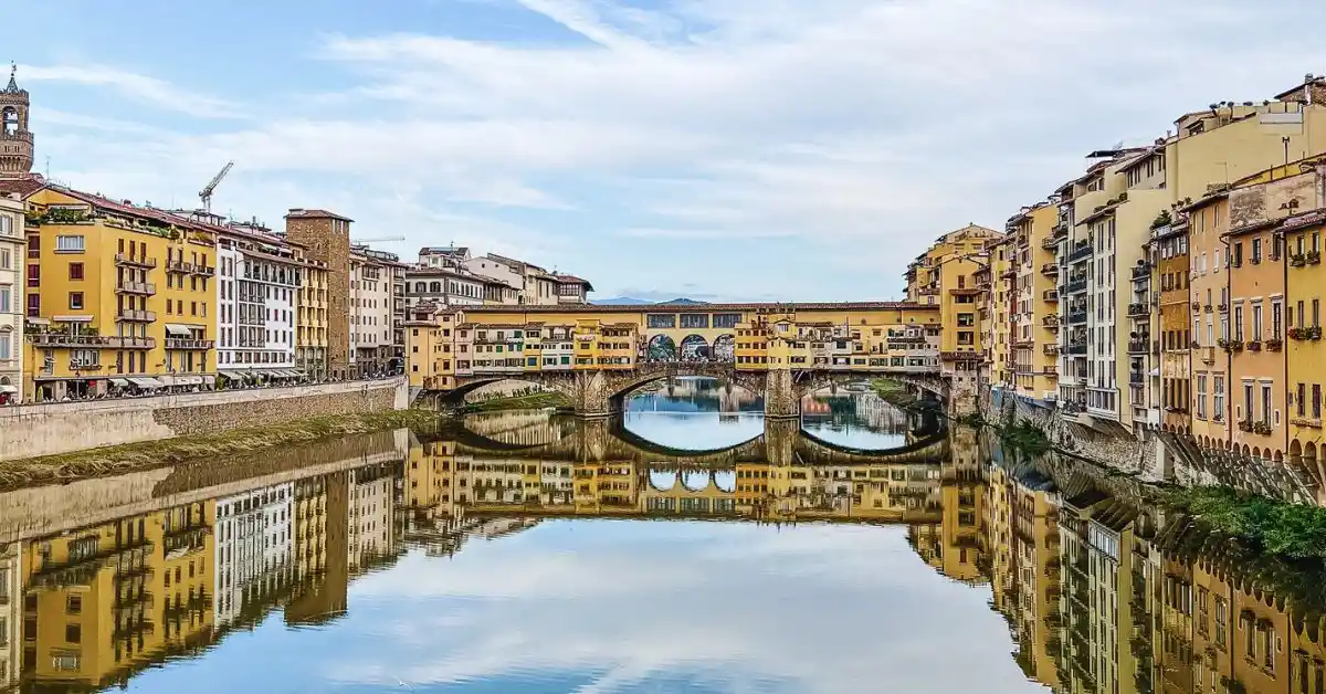 View of Ponte Vecchio over the Arno River in Florence, Italy, on a clear day, an example of what you'll see during one day in florence italy