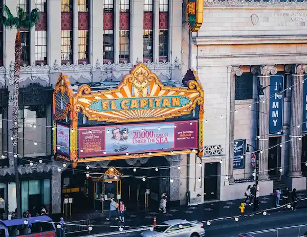 El Capitan Theatre in Hollywood, adorned with bright lights and classic marquee.