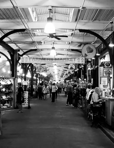 Inside the French Market in New Orleans, featuring local vendors and shoppers