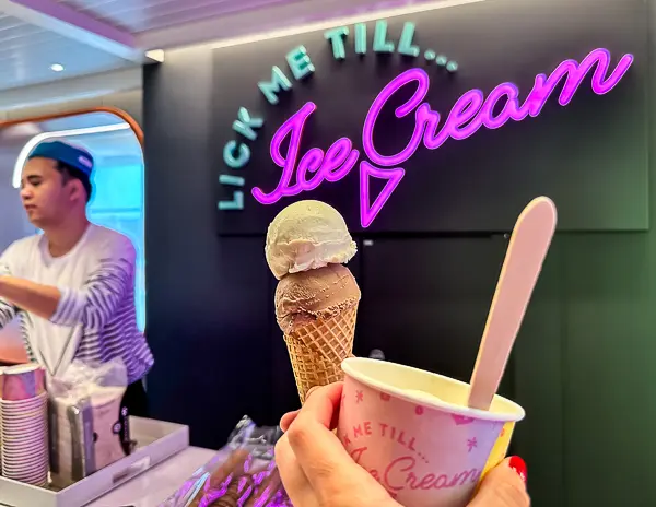 image of an ice cream shop aboard a cruise, specifically with the sign "Lick Me Till... Ice Cream." 