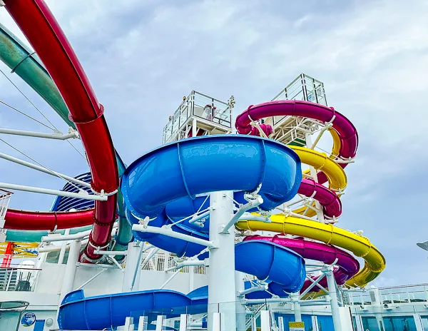 Colorful waterslides on an NCL Breakaway cruise ship.