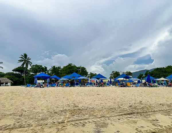 each view with blue lounge chairs and umbrellas at Playa del Pueblito.