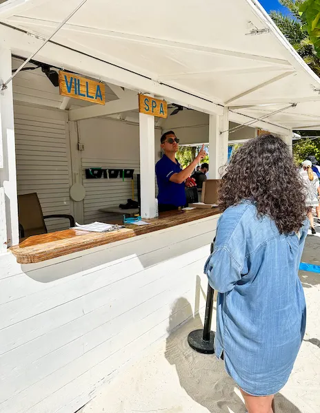 kathy checking in at a villa booth at Great Stirrup Cay.