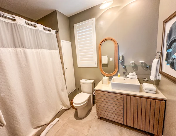 Full bathroom with shower and modern amenities in a Lagoon Villa at Silver Cove, Great Stirrup Cay.