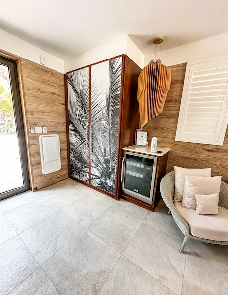 Mini-fridge and seating area in a Lagoon Villa at Silver Cov