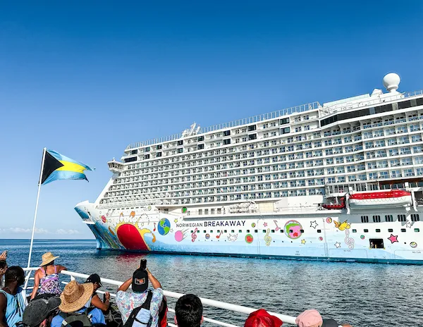 cruise passengers on a tender boat leaving the Norwegian Breakaway cruise ship to Great Stirrup Cay.