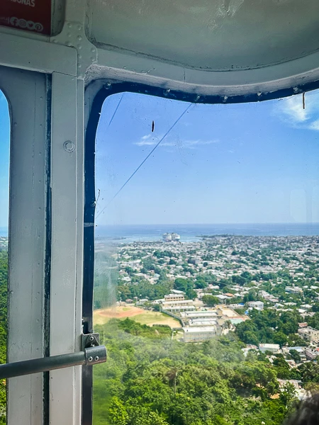 View of Puerto Plata city and cruise ships docked from inside the cable car.