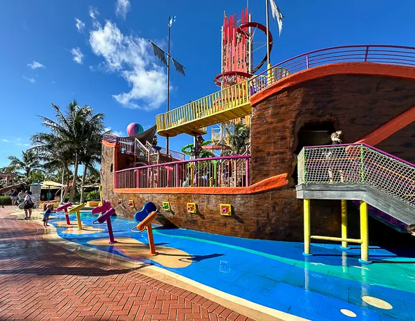 Captain Jill’s Galleon at CocoCay, a colorful ship-themed water play area featuring water cannons, slides, and interactive elements for kids.