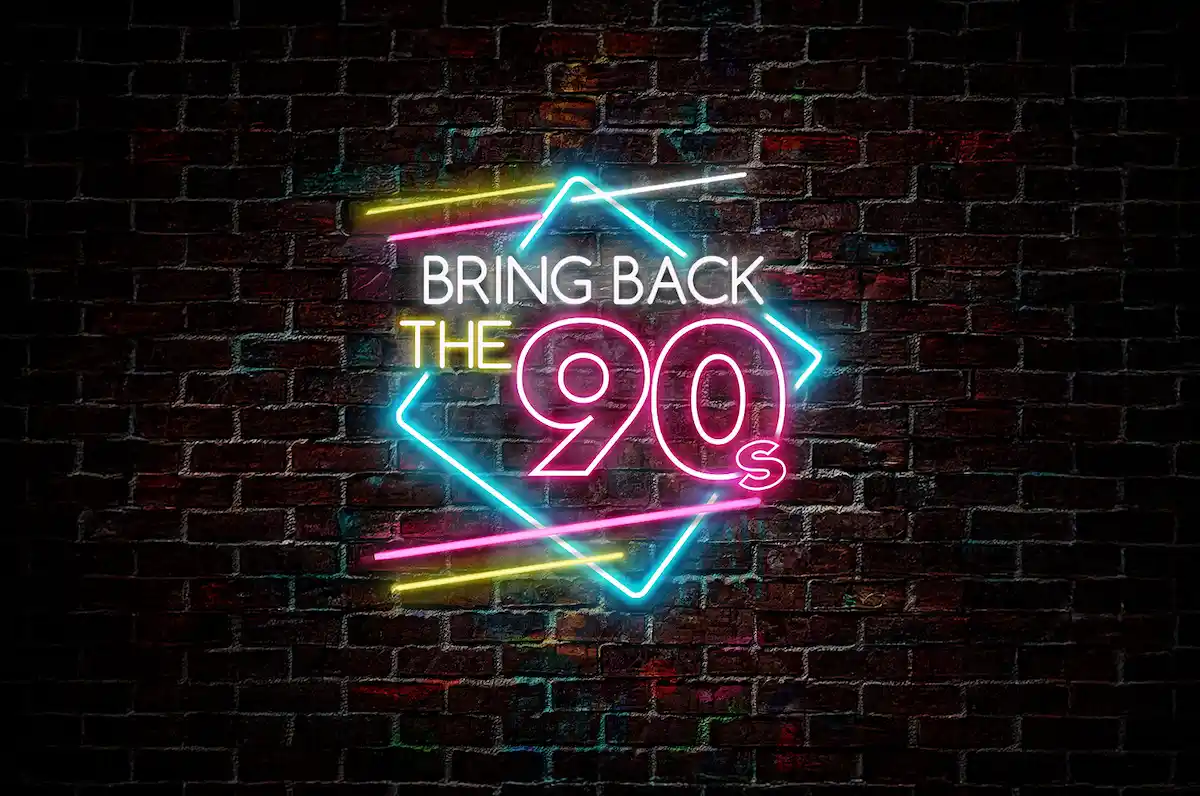 Neon sign reading 'Bring Back the 90s' in bright colors against a dark brick wall, representing Norwegian Cruise Line's new entertainment show.